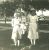 Lowell, Alice Nelson and older sister, Lillian Nelson Hofstad, with doll.